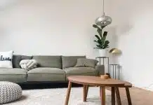 gray 2 seat sofa near brown wooden coffee table